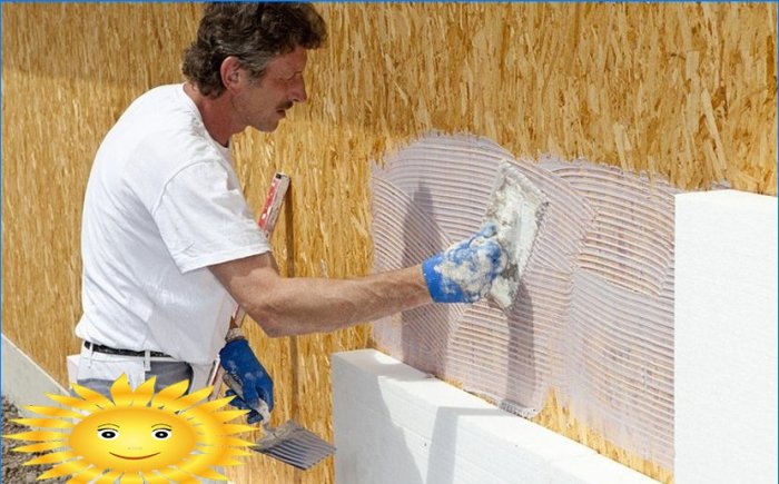 Installation d'une façade humide sur une maison à ossature