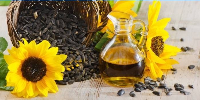 Graines de tournesol et huile de tournesol dans un bocal en verre