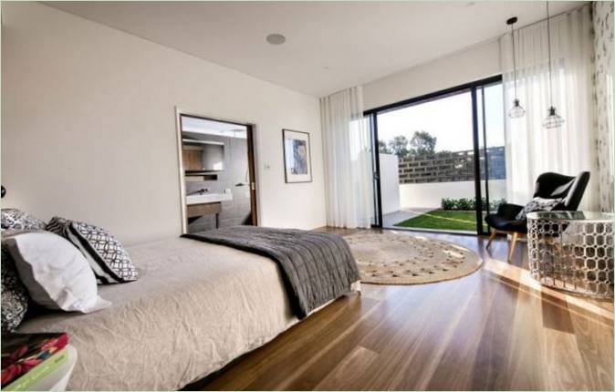 Aménagement intérieur d'un chalet par Residential Attitudes : chambre à coucher